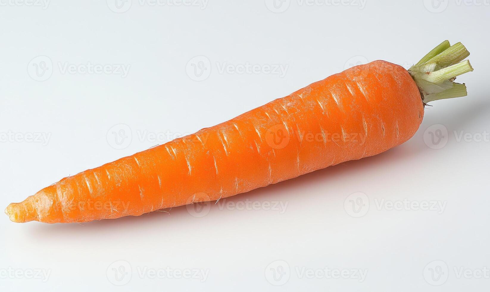 A carrot is shown on a white background, closeup photo