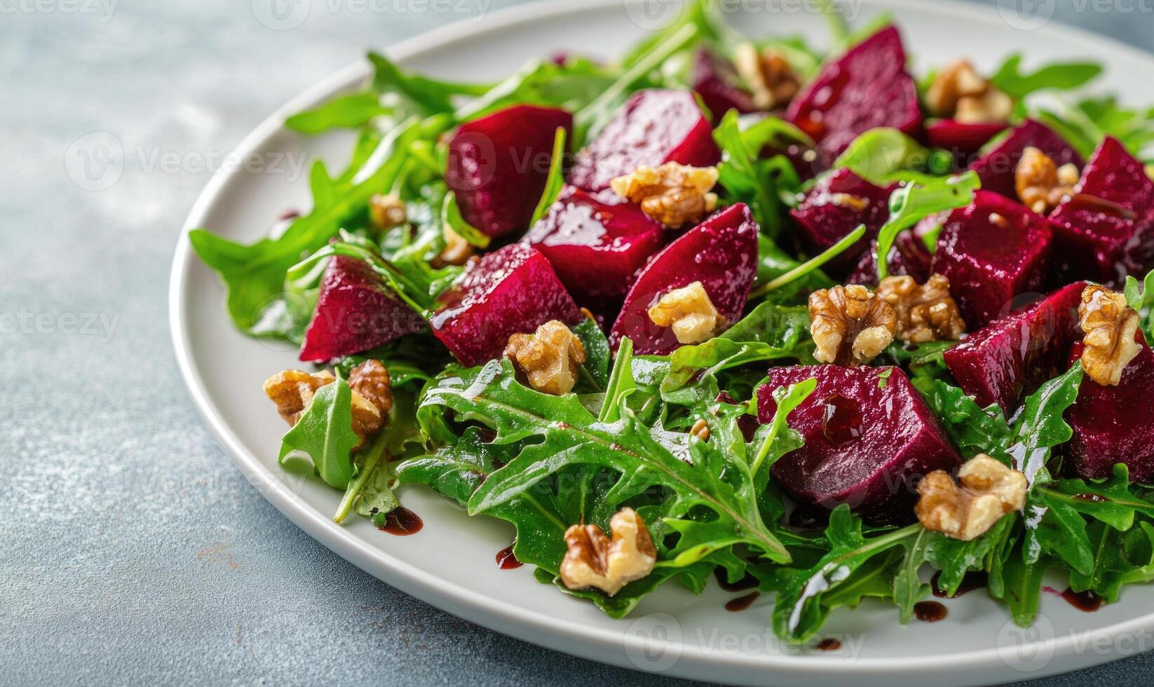beet salad with walnuts and arugula. photo