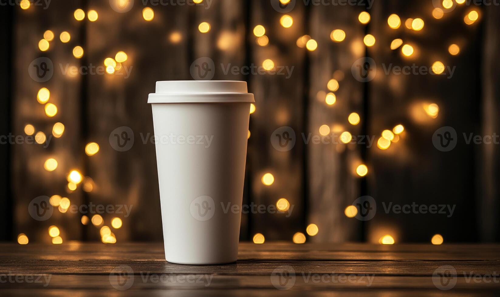 a white cup with a light on it on a wooden table photo