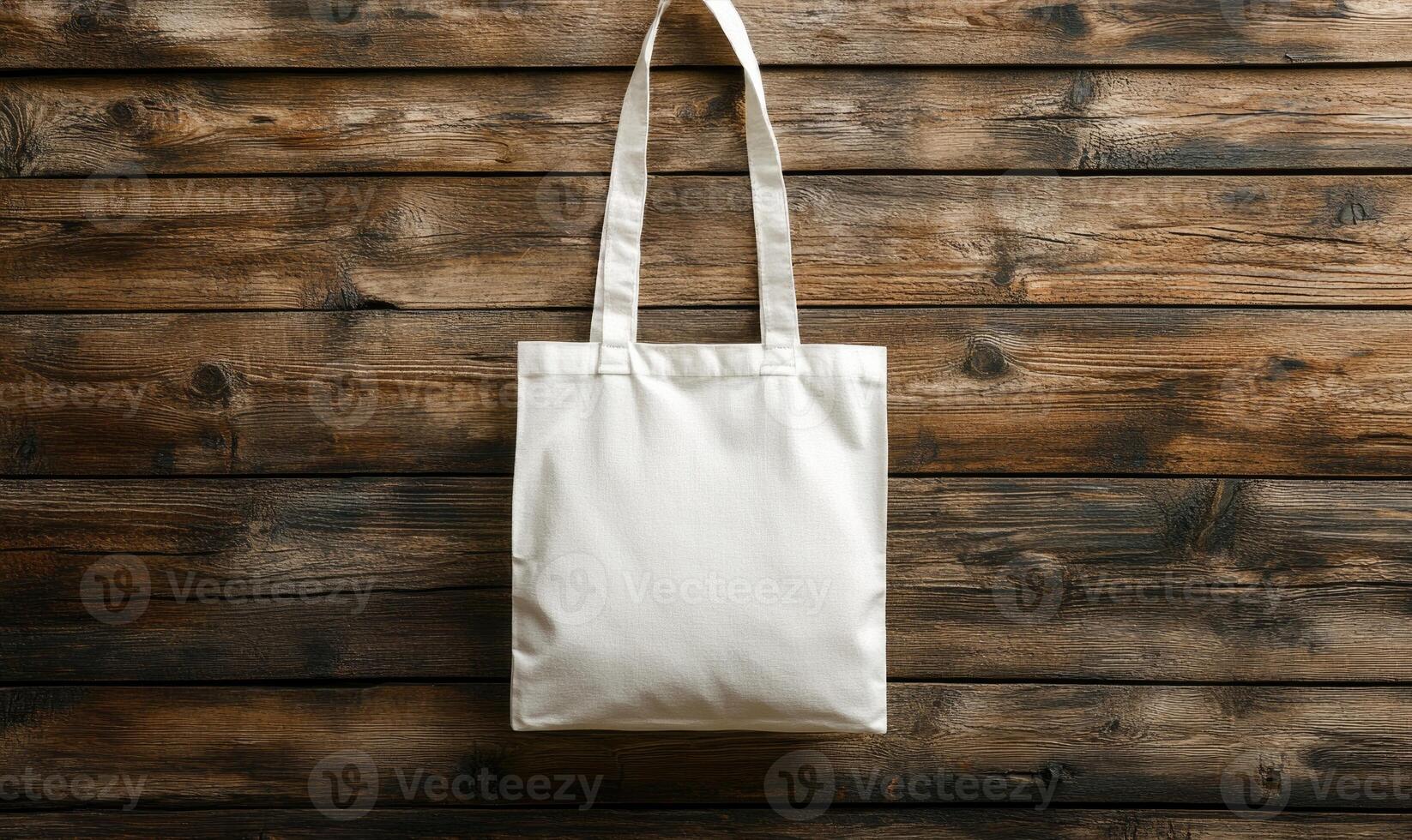 white cotton tote bag mockup on wooden background photo
