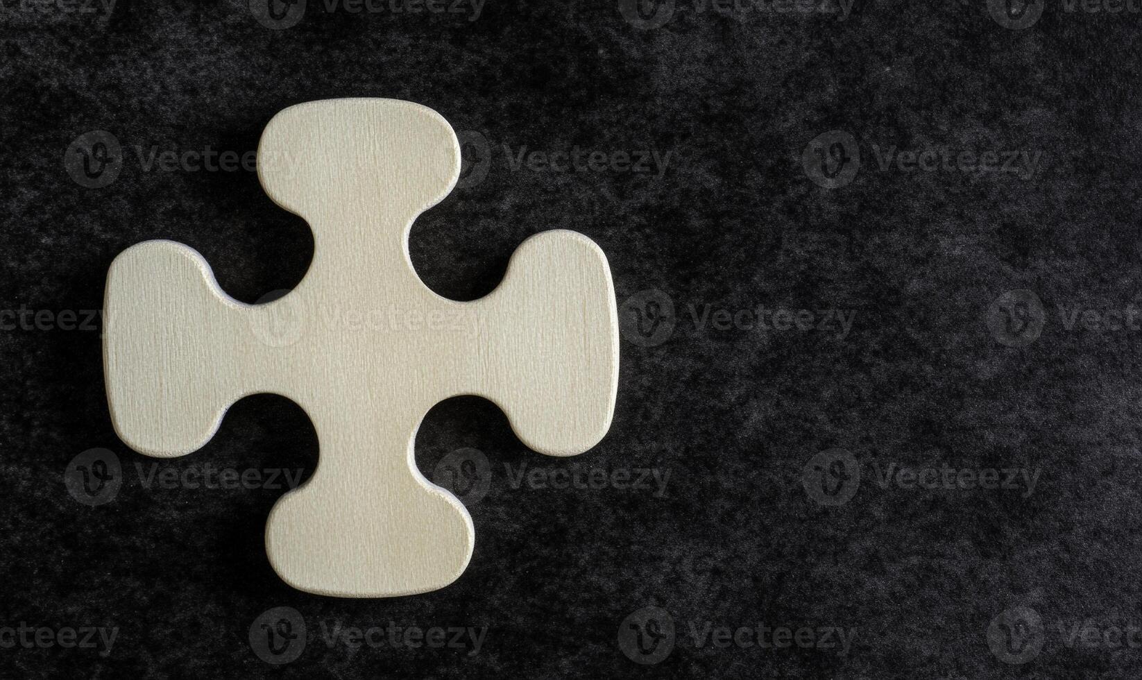 Solo Wooden Puzzle Piece on Dark Background, Symbolizing Individuality and Uniqueness in Design or Play, Inspirational Image for Creative Projects photo