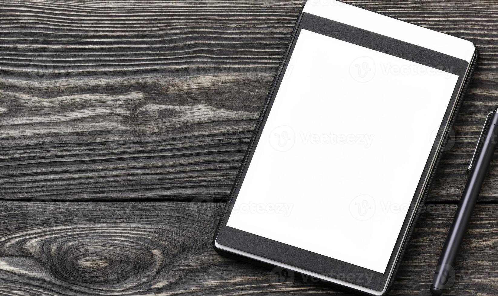 Blank digital tablet with stylus on rustic wooden background for design mockups, presentations, and creative brainstorming activities photo