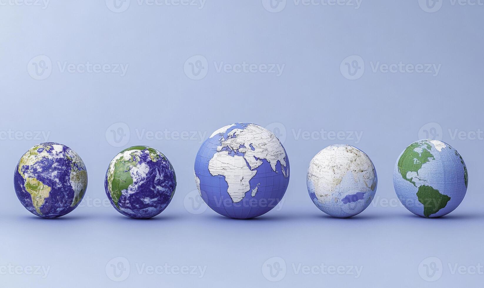 Five different colored eggs with the earth on them photo