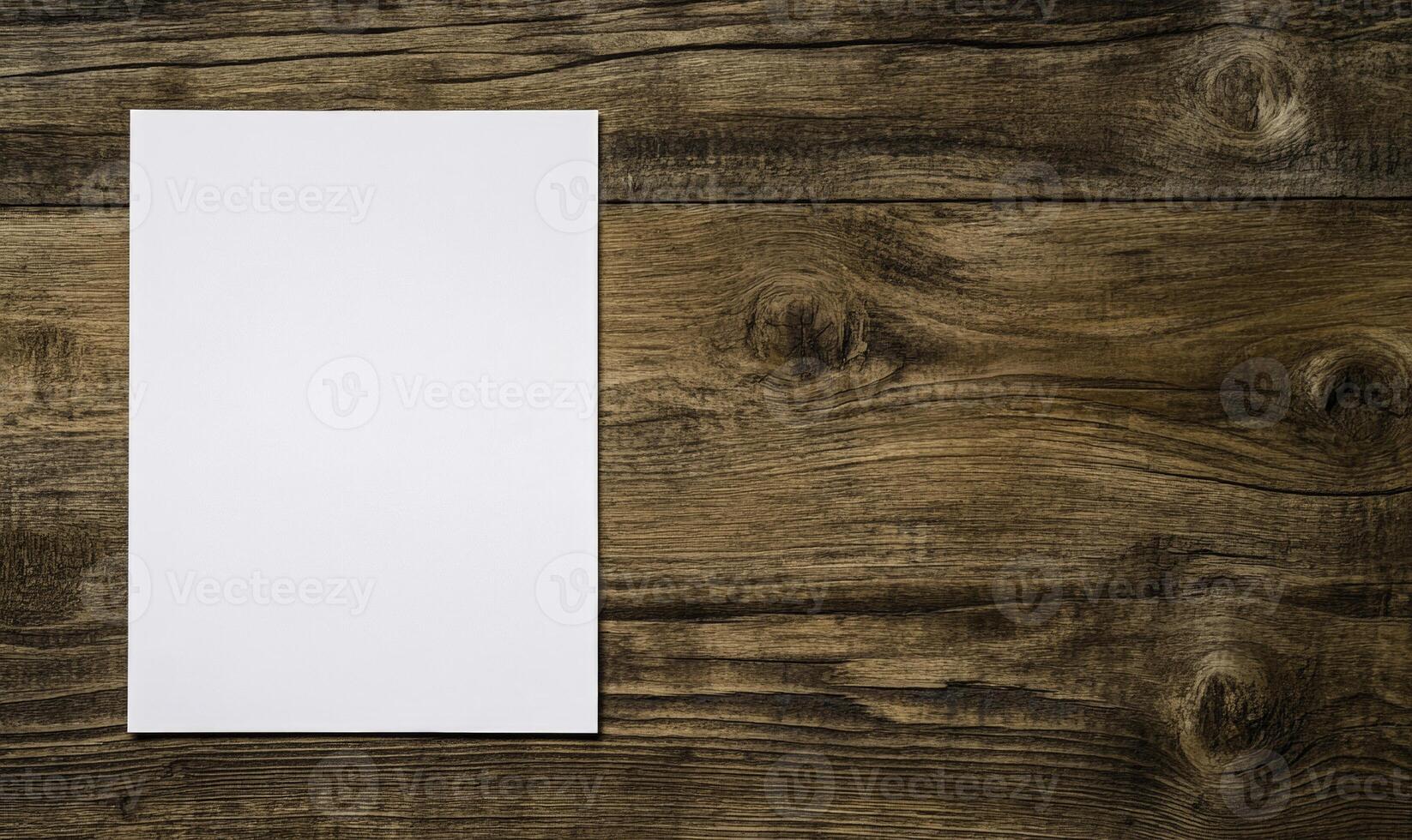 Blank white paper on wooden table photo