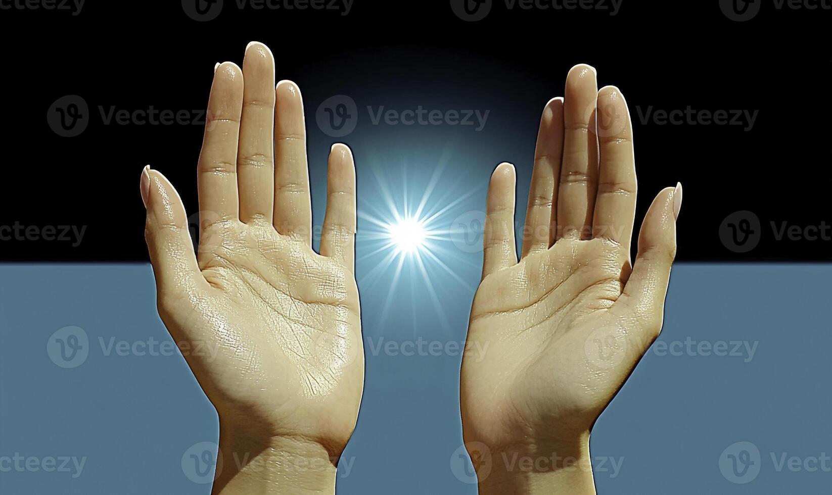 Two hands with a light shining in between them photo