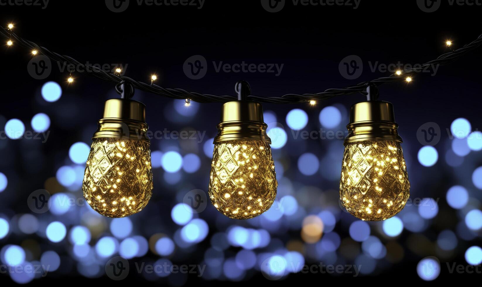 Three golden light bulbs on a string photo