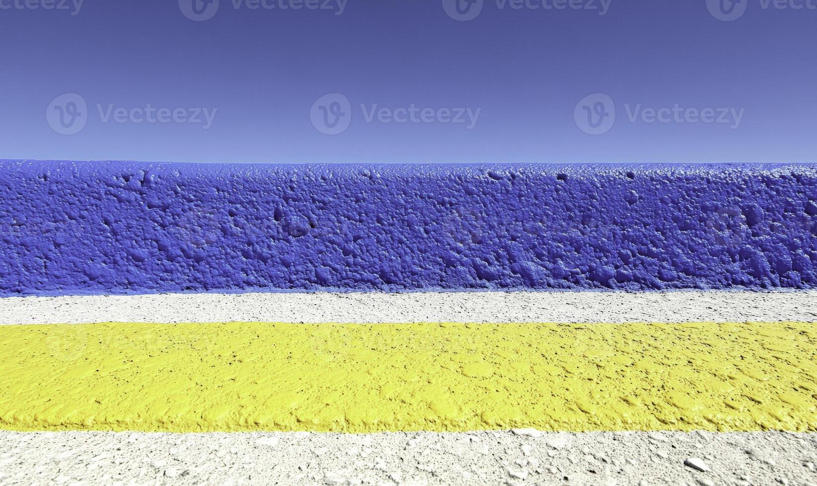 A blue and yellow striped wall with a blue stripe photo