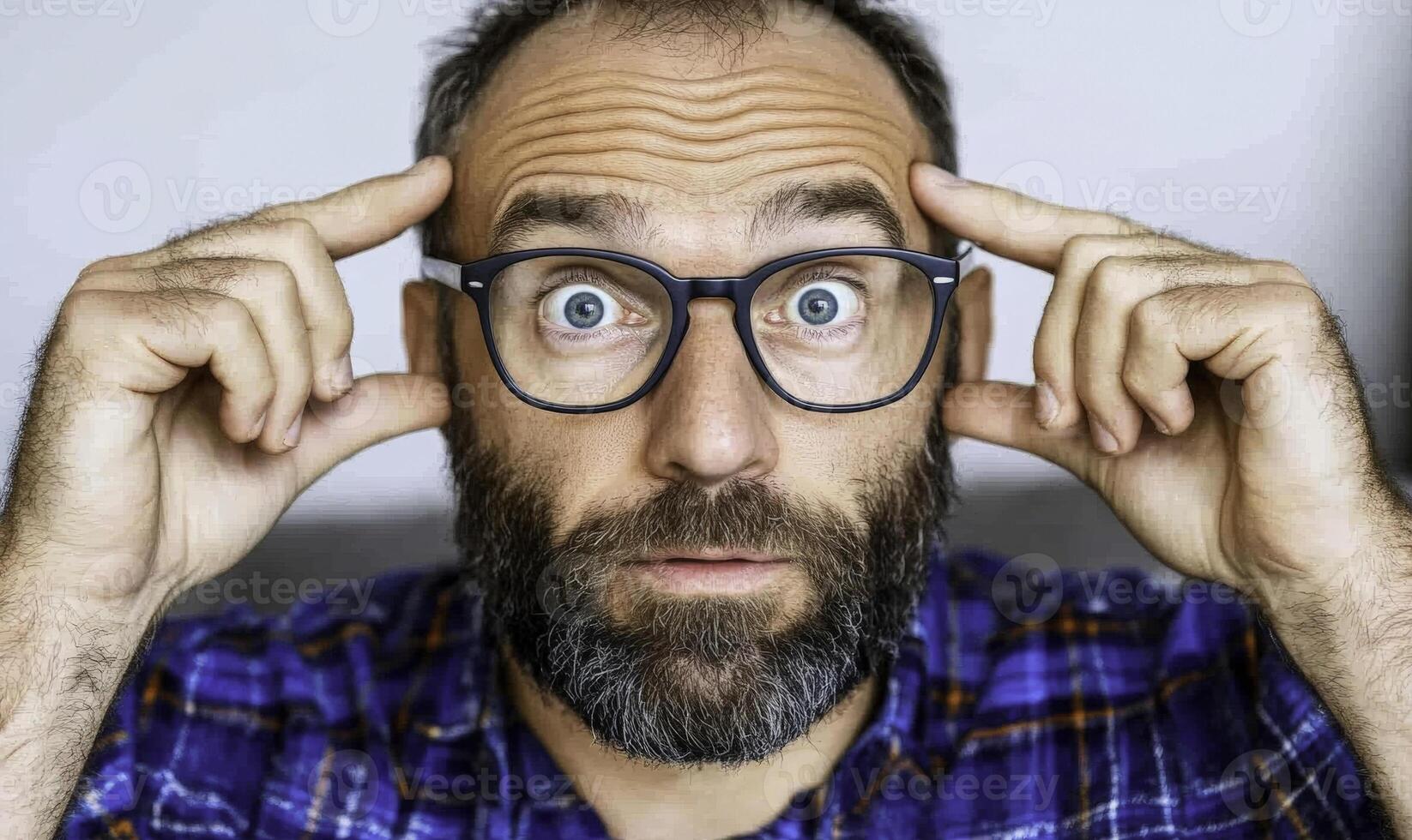 A man with glasses on his head photo