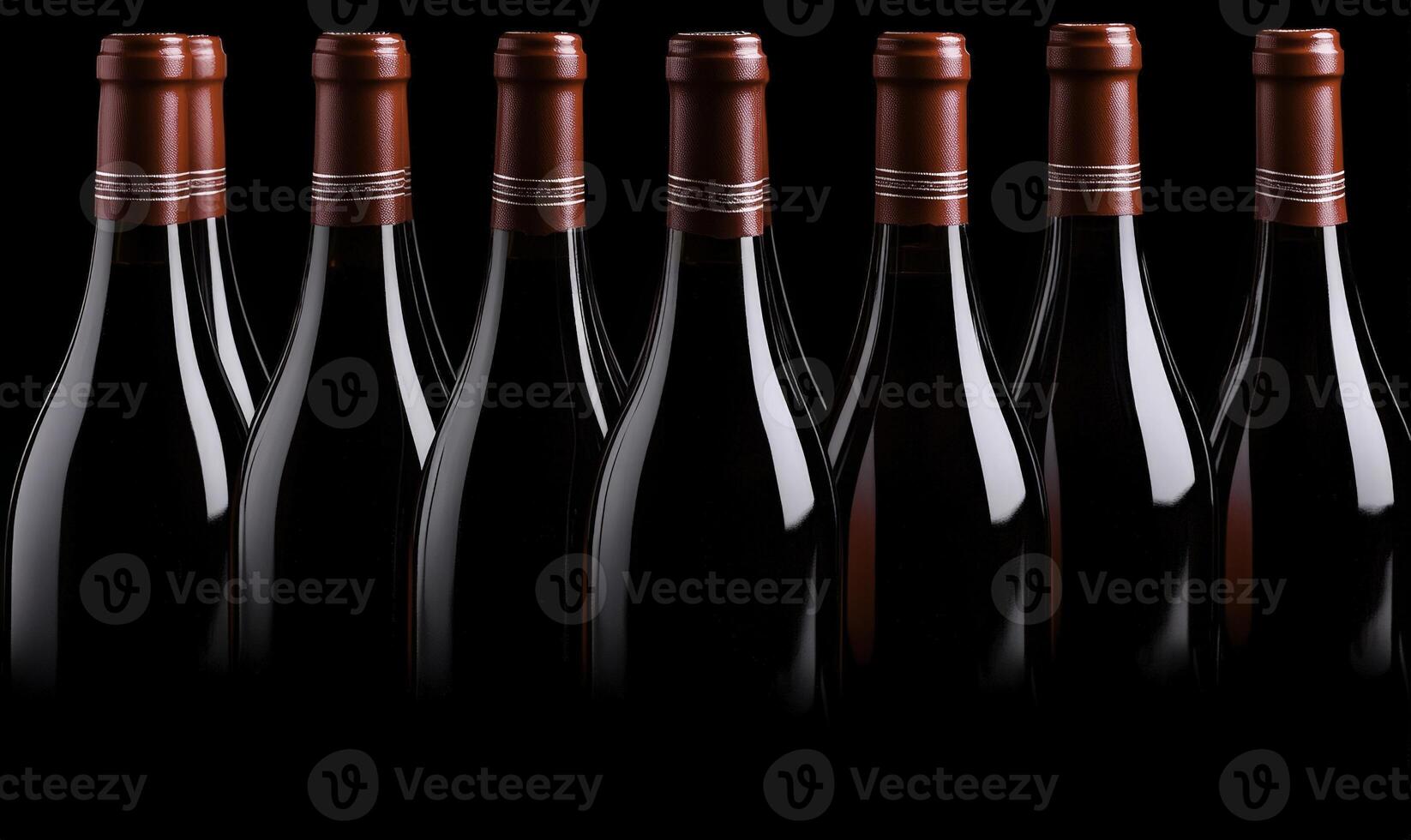 A row of wine bottles on a black background photo