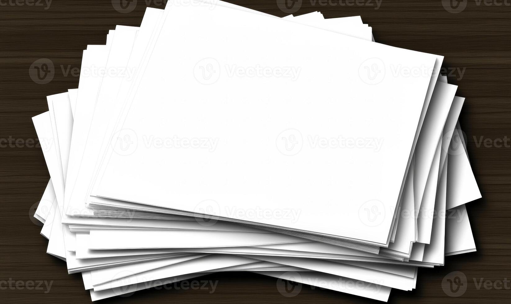 A stack of blank paper on a wooden table photo