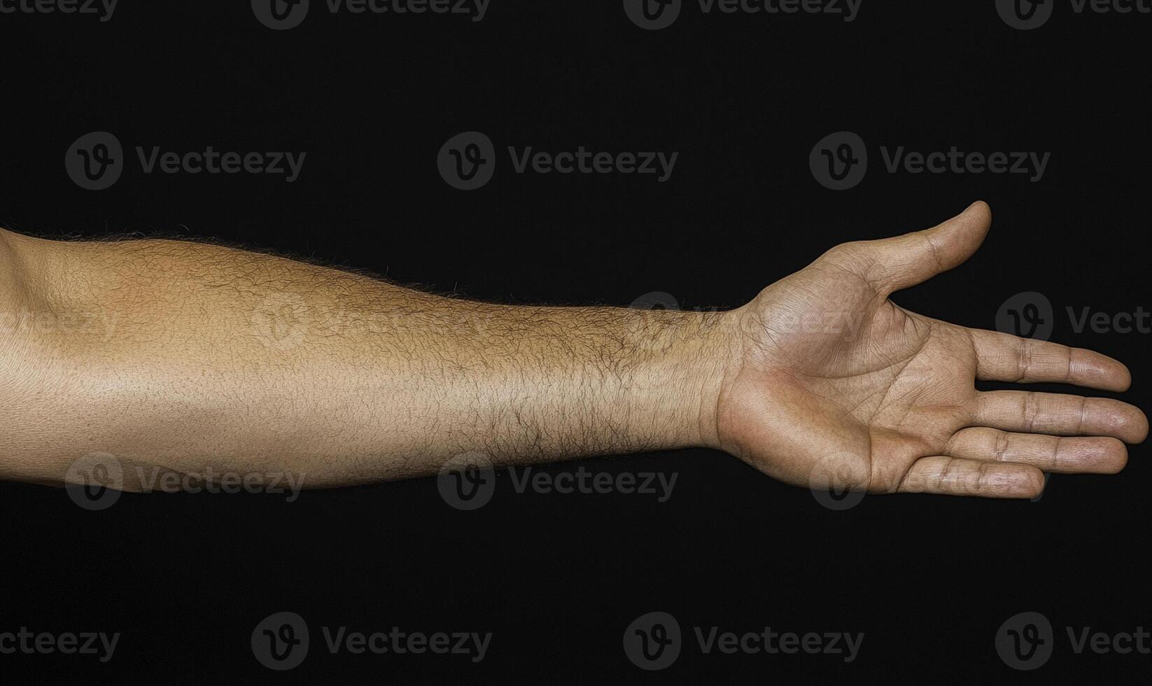 A man's arm is stretched out to the side photo