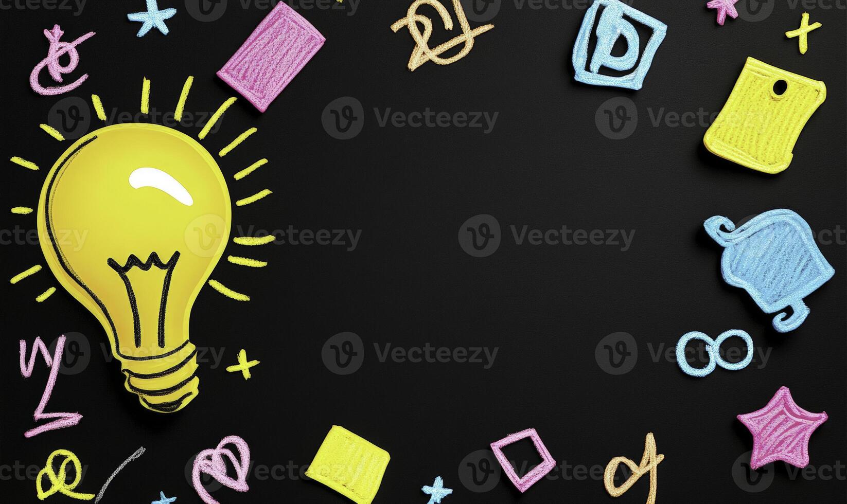 A light bulb surrounded by various items on a black background photo