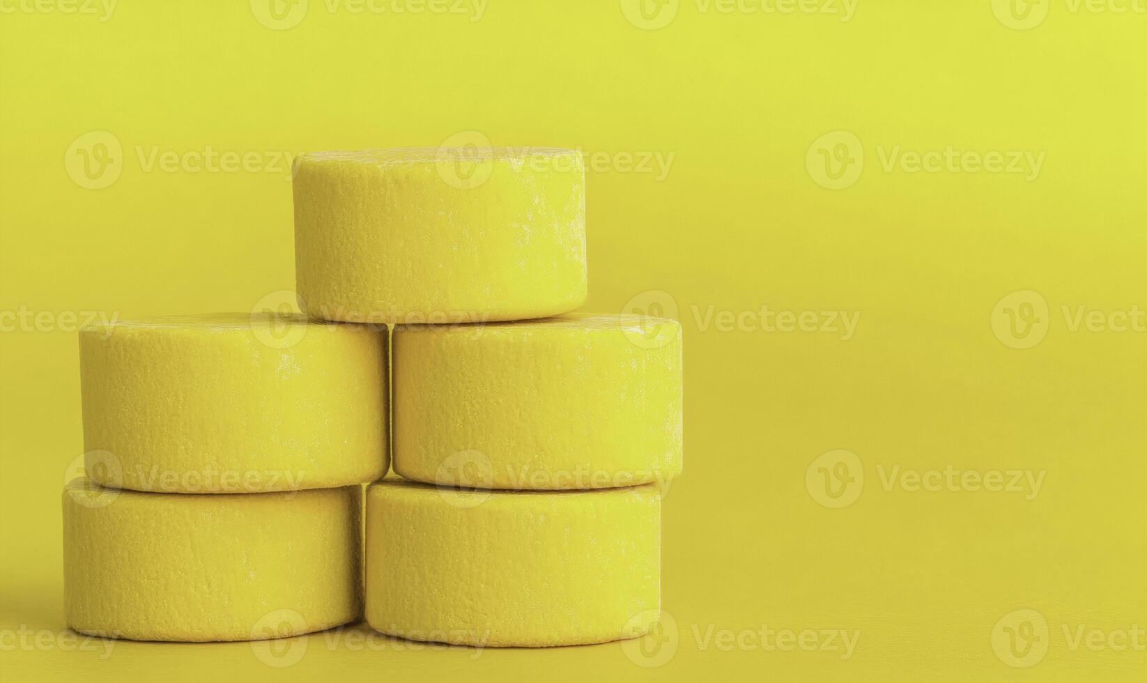 Yellow marshmallows stacked on top of each other photo