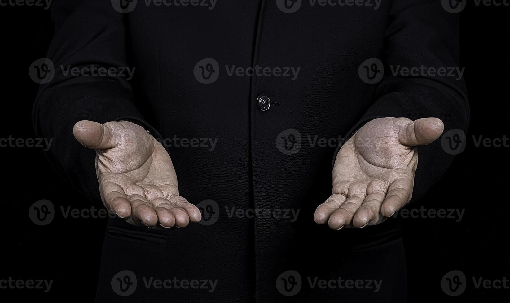 Open Hands Gesture of Hospitality and Welcome, Symbol of Acceptance and Invitation with Dark Background in Formal Attire for Business or Personal Situations photo