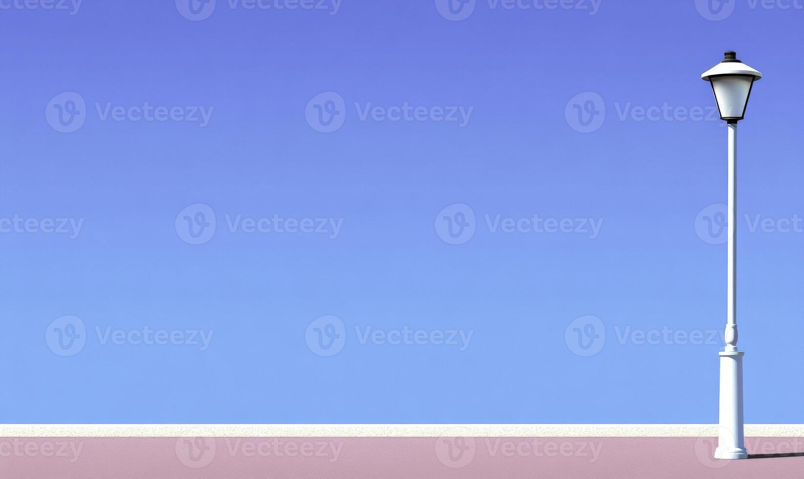 Minimalist View of a Light Post Against a Clear Blue Sky with Soft Pink Ground in a Calm and Serene Urban Atmosphere for Relaxation and Reflection photo