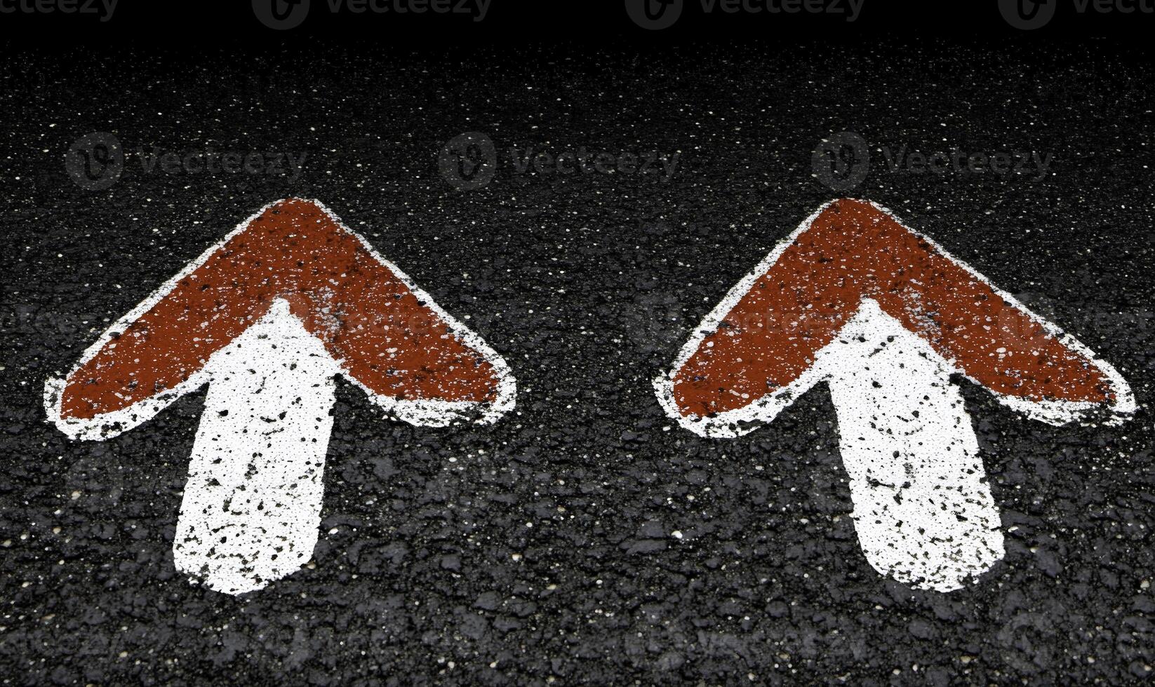 Dual Directional Arrows on Asphalt Surface Indicating Right and Left Turn for Effective Road Traffic Guidance During Daytime with Clear Visibility photo