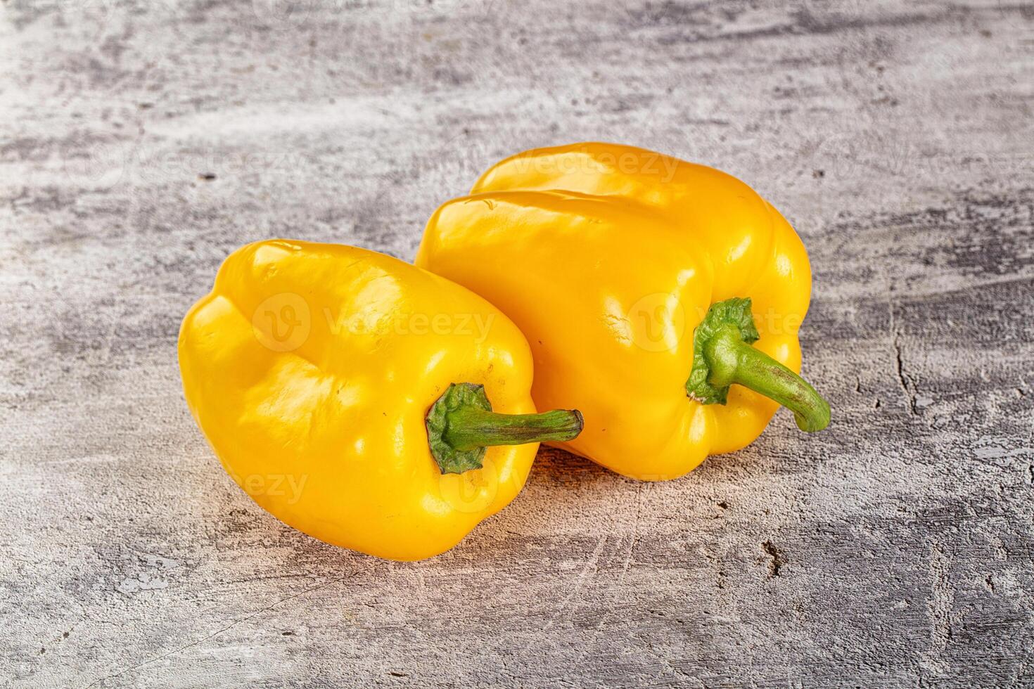 Two yellow bell peppers photo
