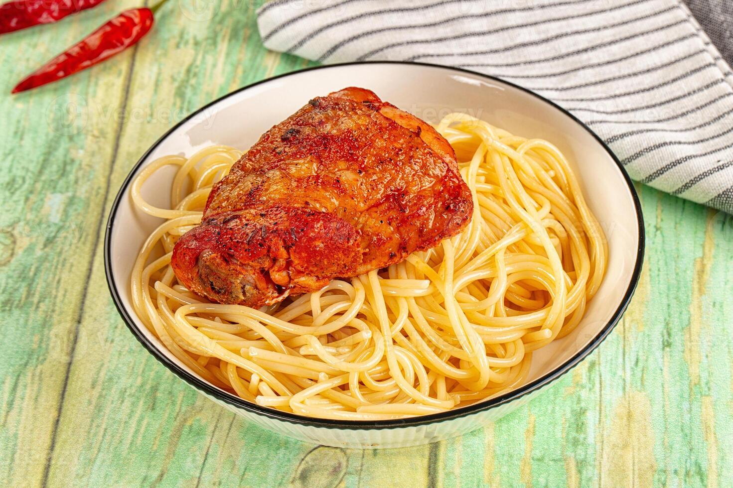 A bowl of spaghetti and meat in a white bowl photo