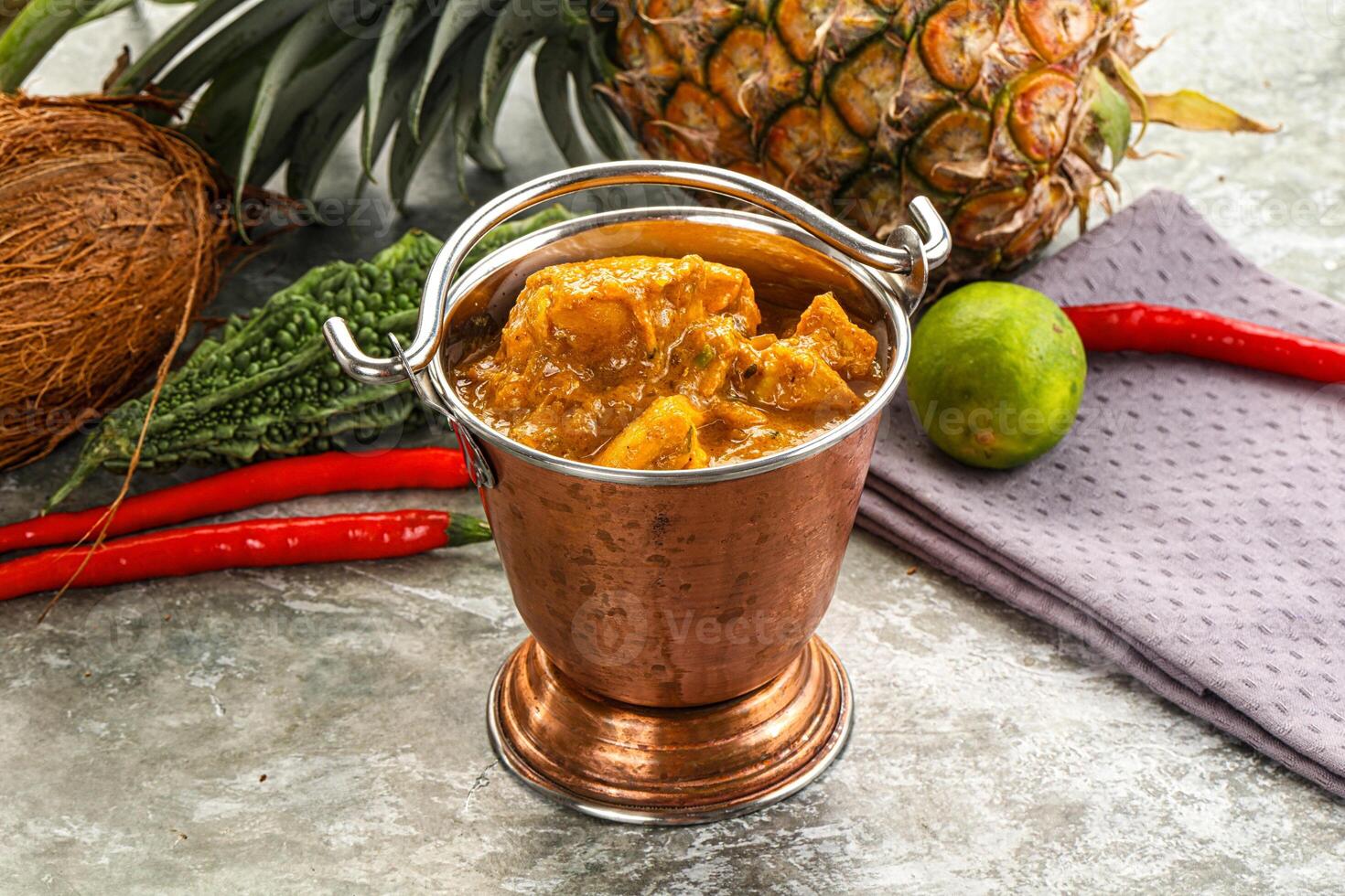 A pineapple, coconut, and other fruits and vegetables photo