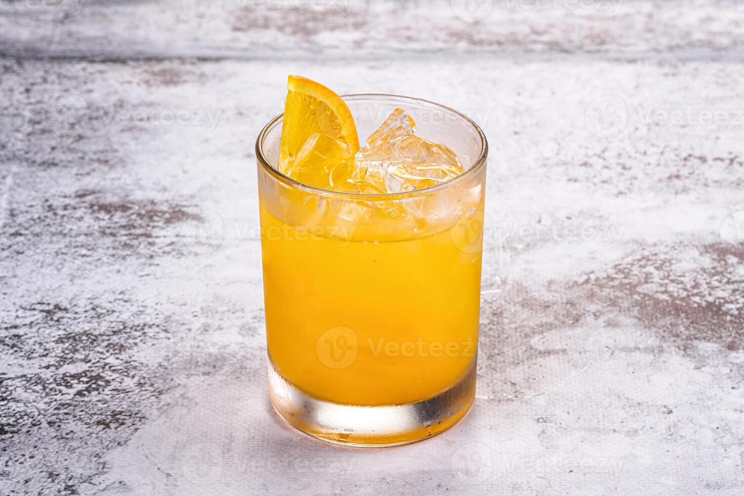 Orange drink in a glass photo