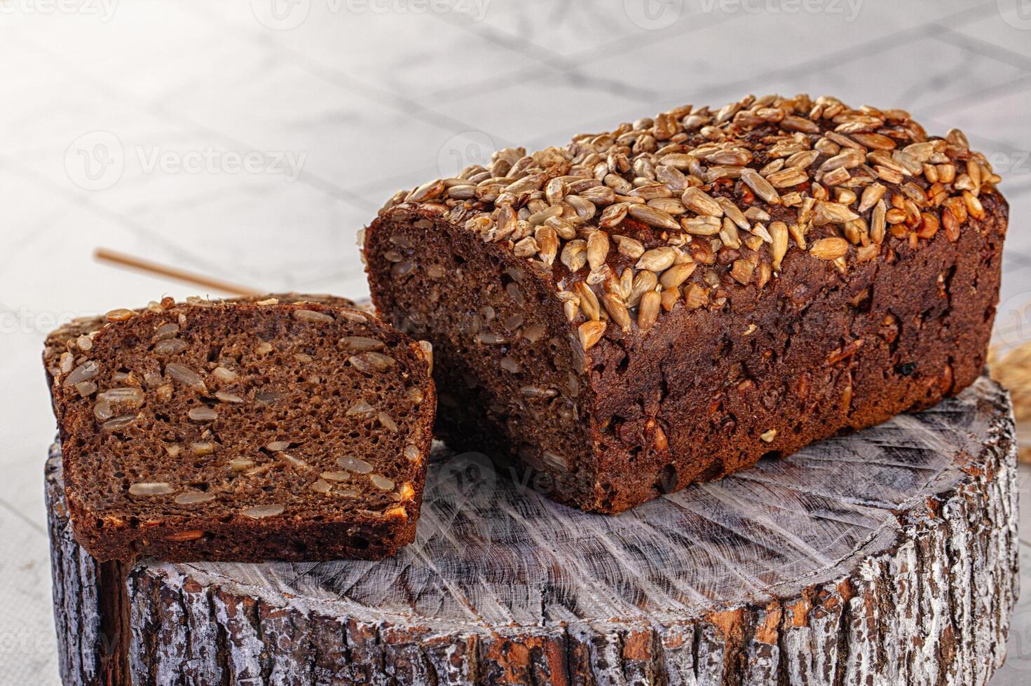 A loaf of bread with seeds on top photo