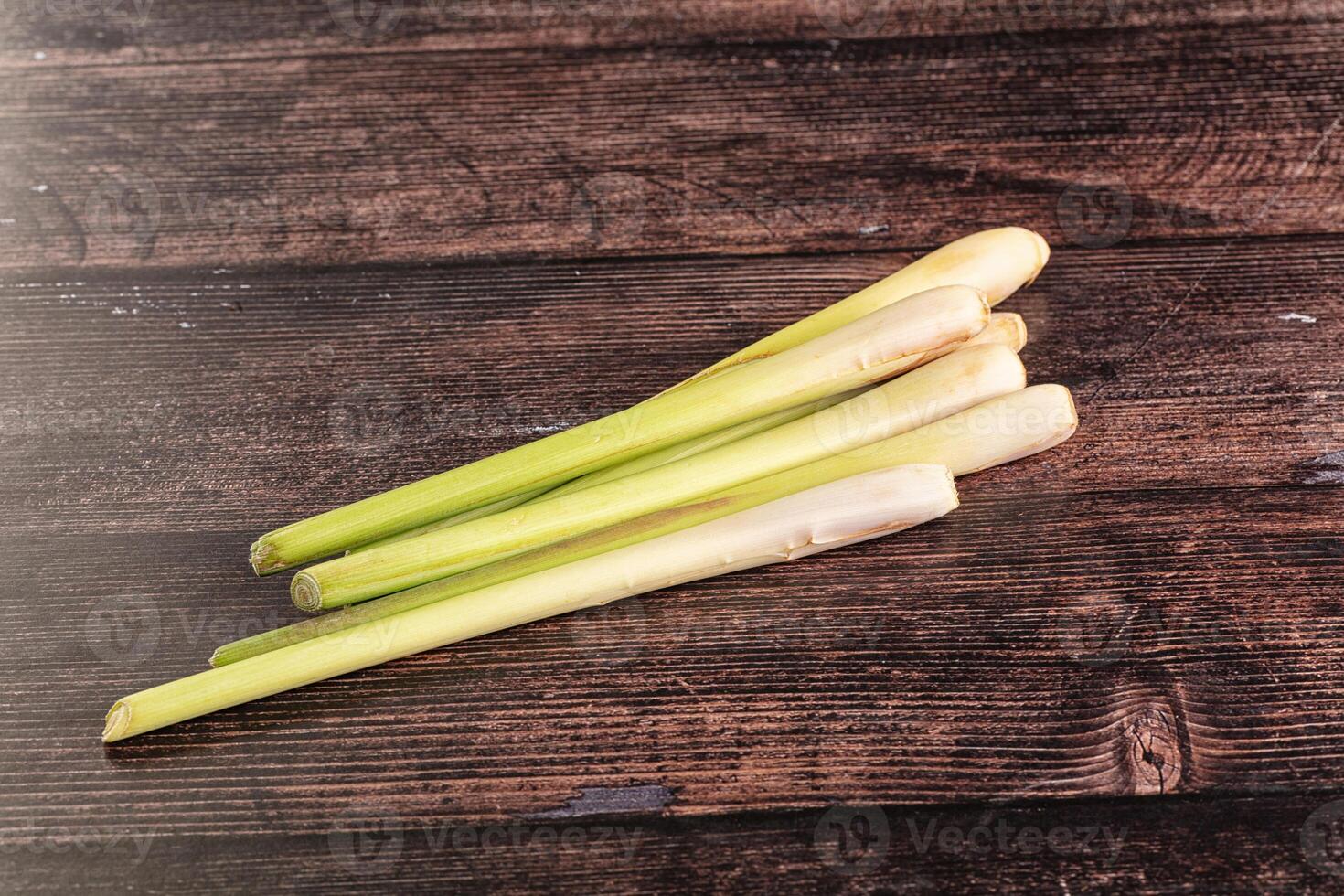 A bunch of leeks on a wooden table photo
