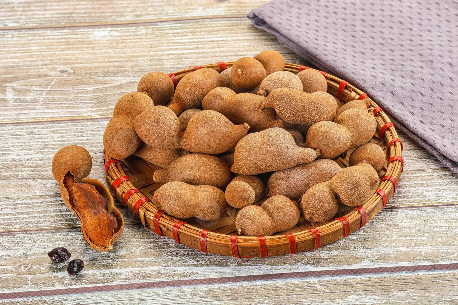 A basket of nuts on a table photo