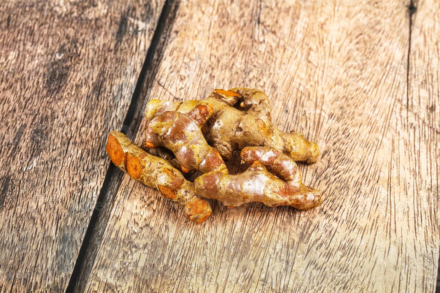Ginger on wooden table photo