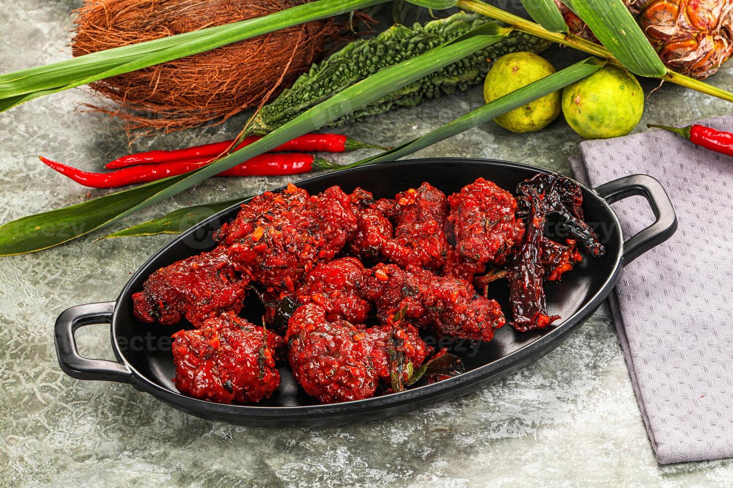 A black dish with food photo