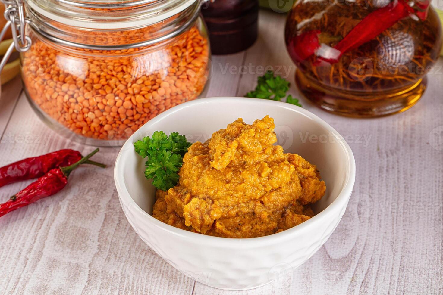 A bowl of hummus with spices and other ingredients photo