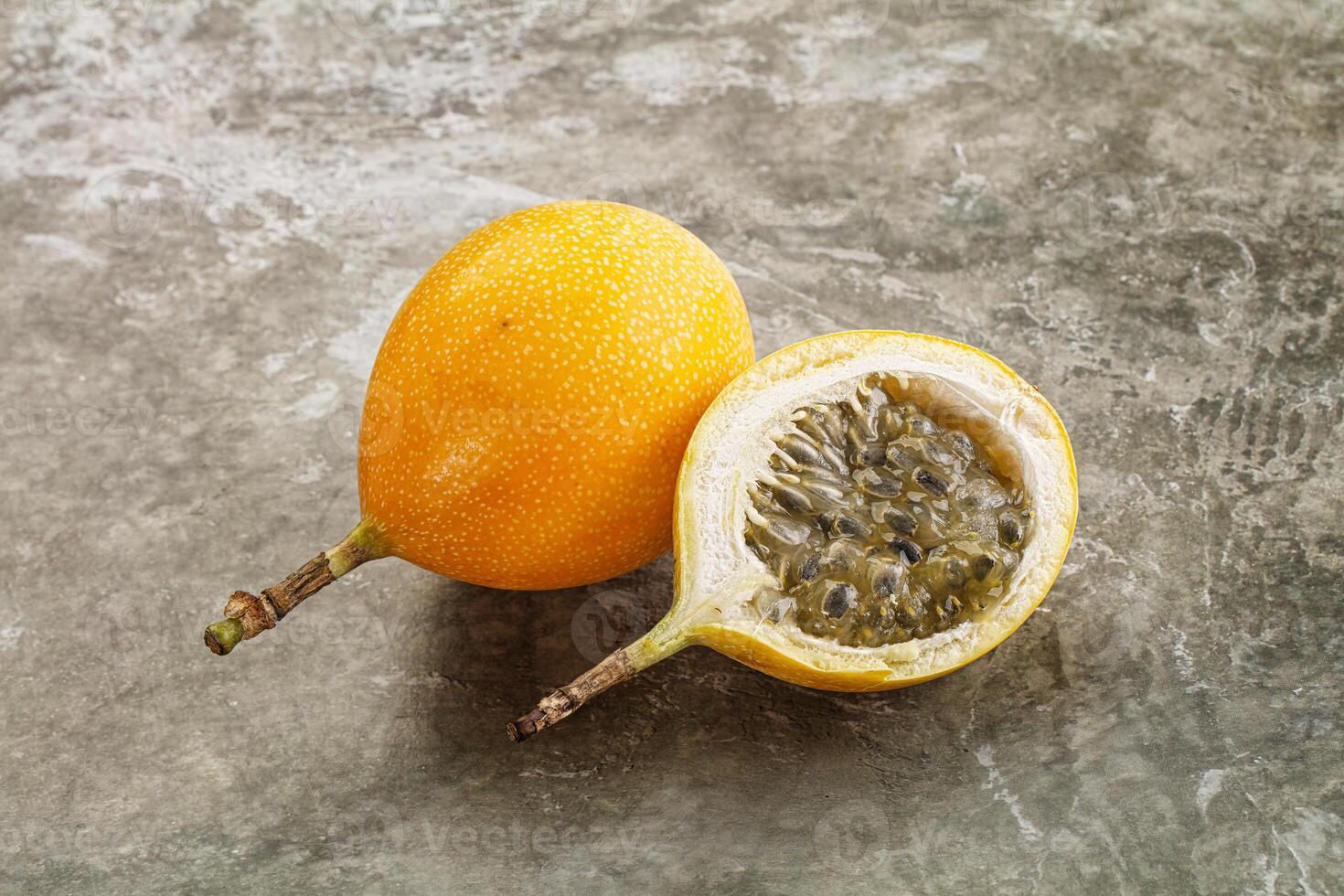 Passion fruit on concrete background photo