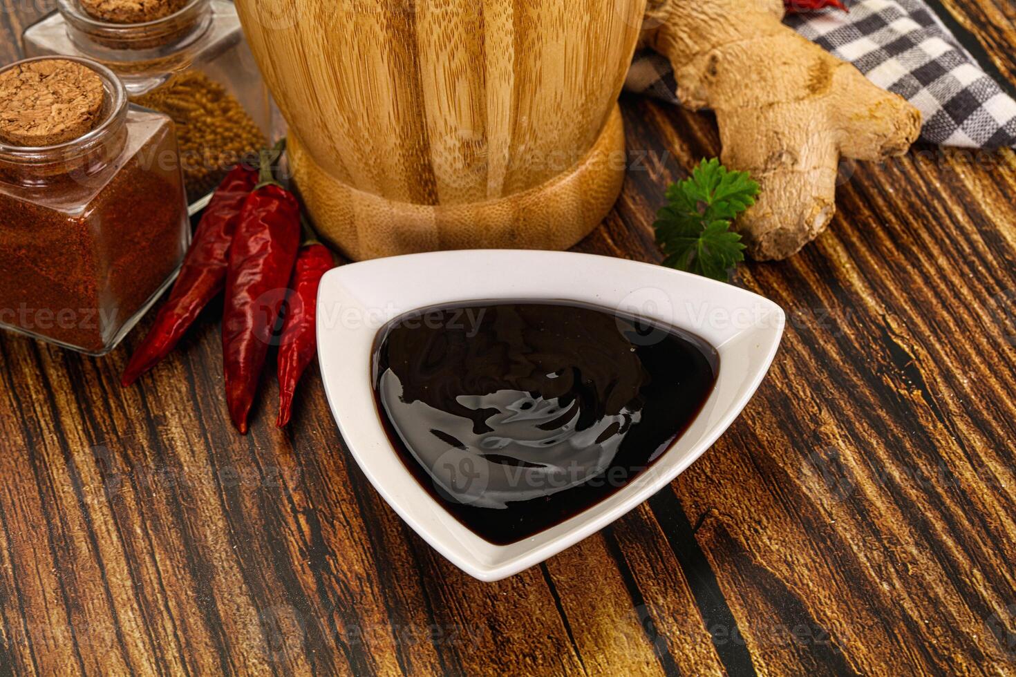A bowl of sauce with spices and ginger photo