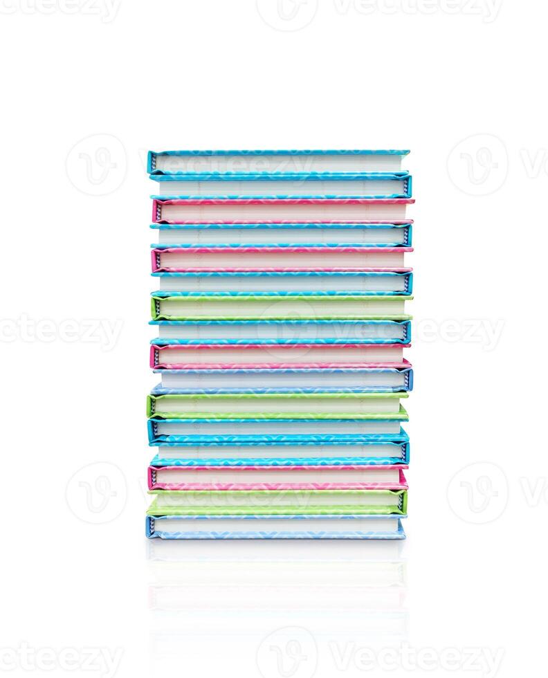 Stack of colorful books, separated on a white background. photo