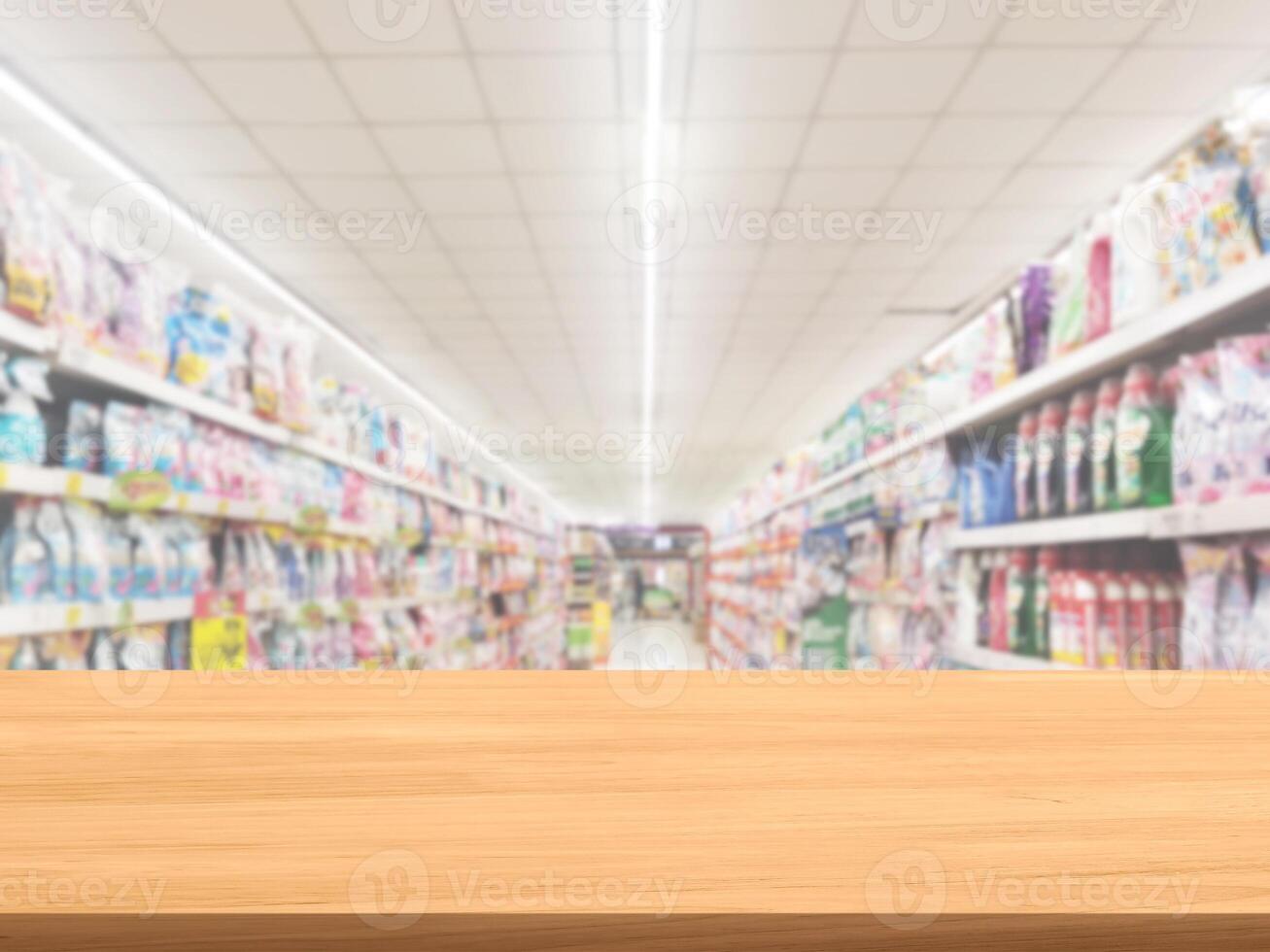 Empty wooden table, blurred shelf background. photo