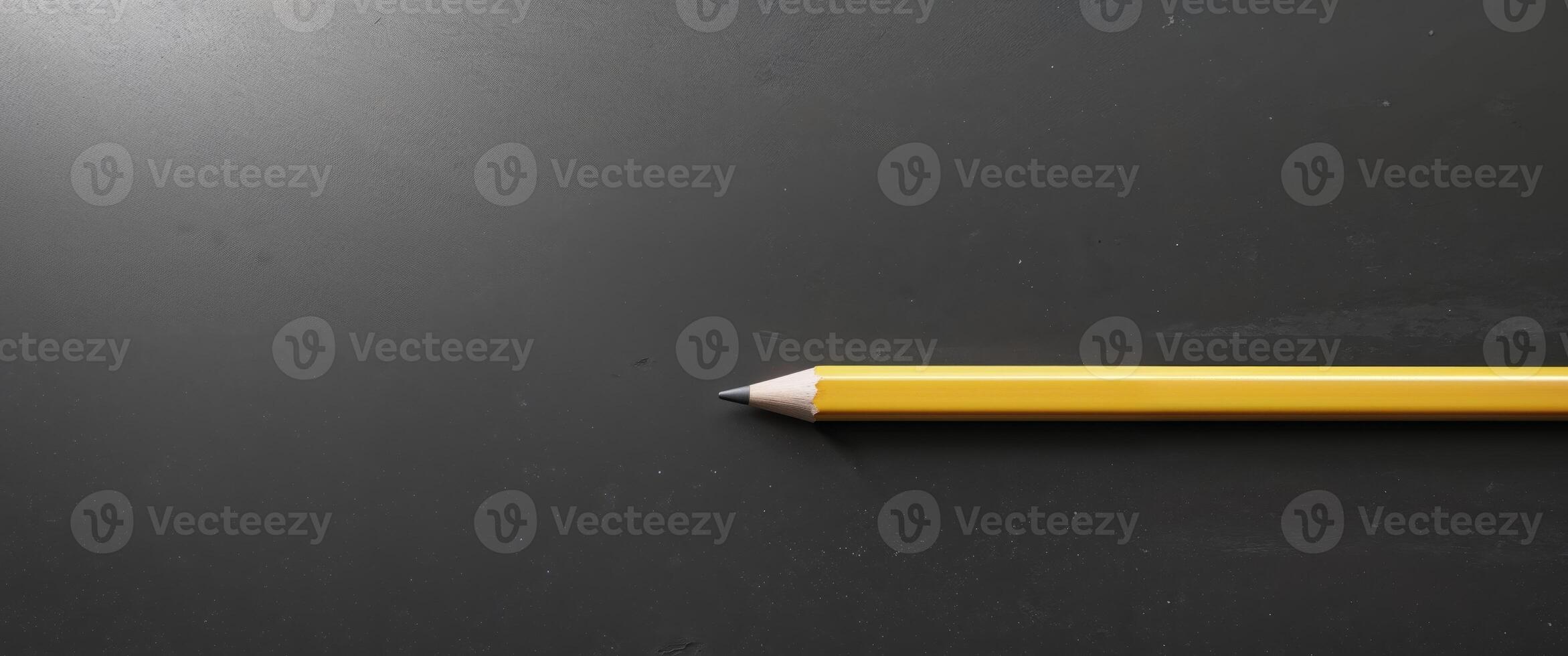 Blank chalkboard with pencil ready to write education learning school supplies. photo