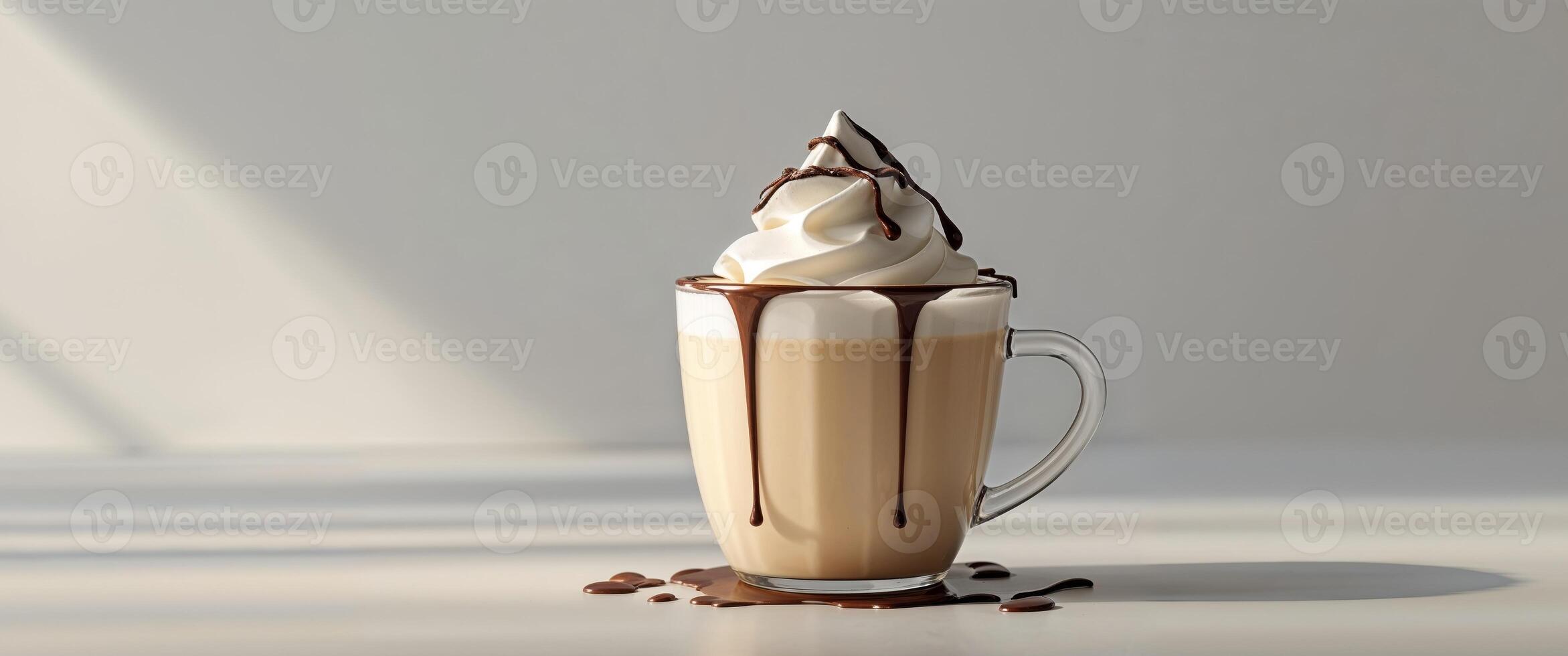 Creamy hazelnut milk with whipped cream and chocolate drizzle in a cup. photo