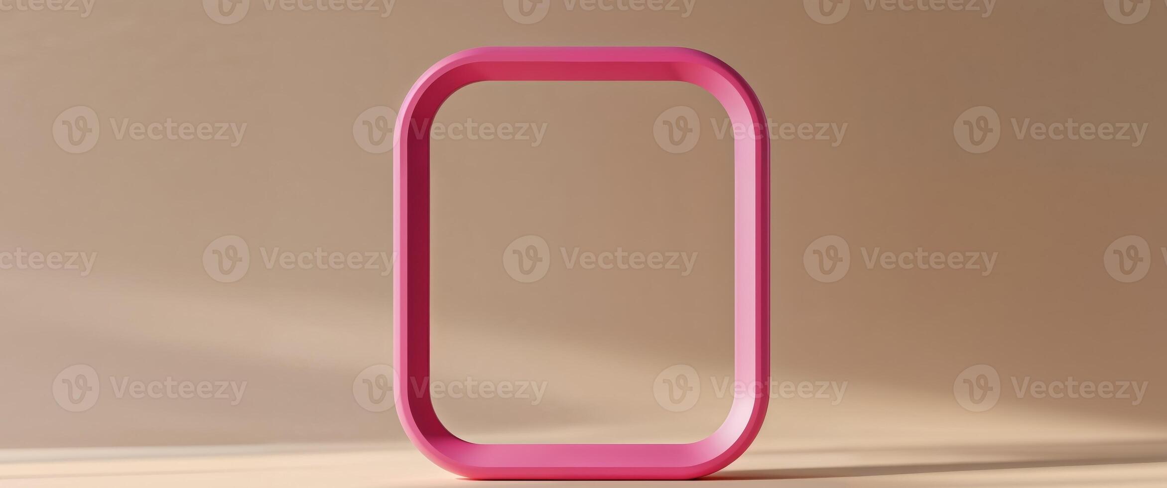 Pink rounded rectangle frame on tan surface backdrop photo
