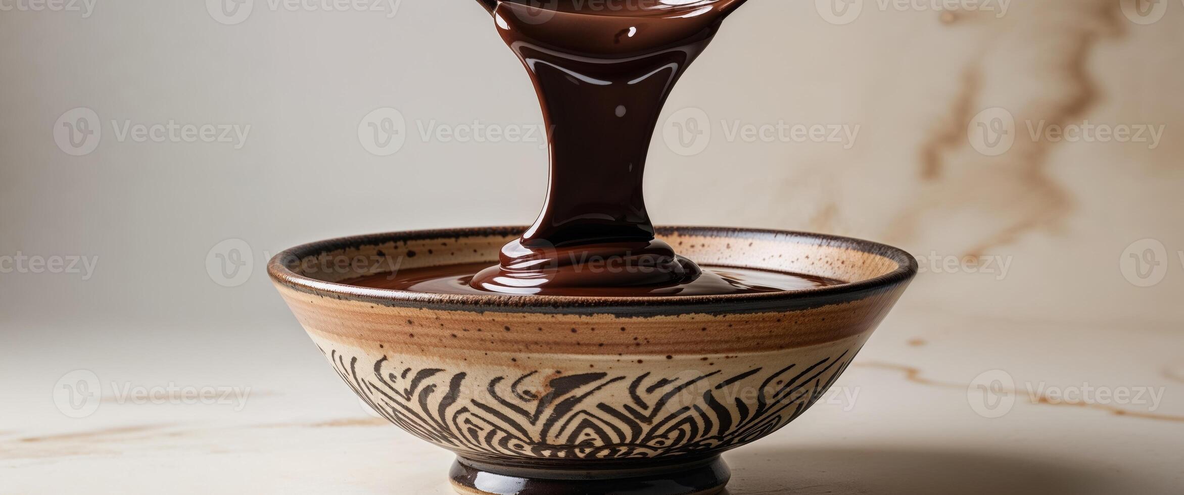A bowl of chocolate being poured into it photo