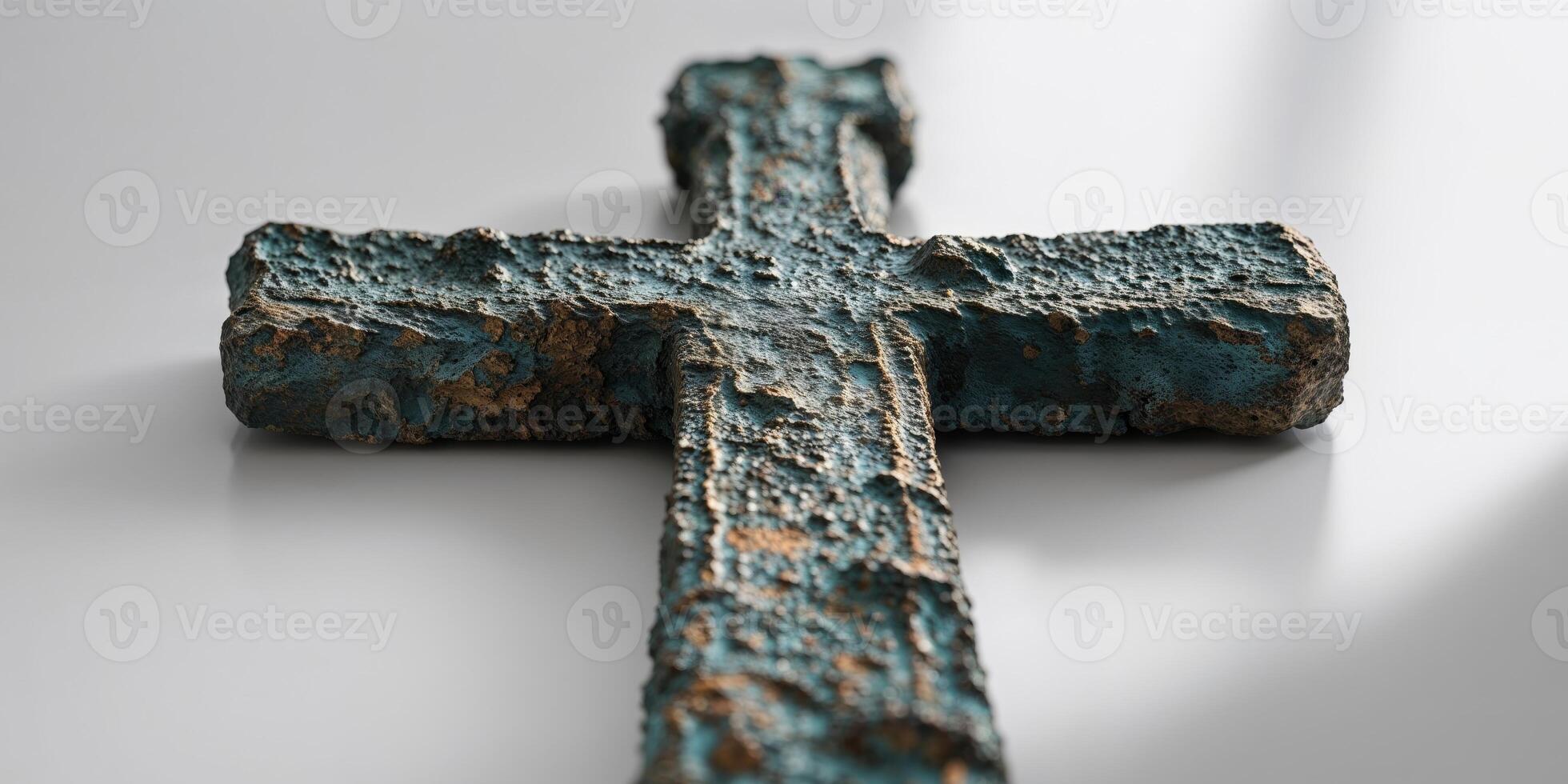 A cross made of old paint is on a table photo