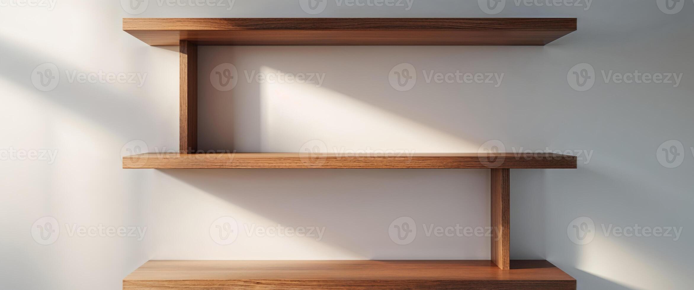 A wooden shelf with a white wall behind it photo