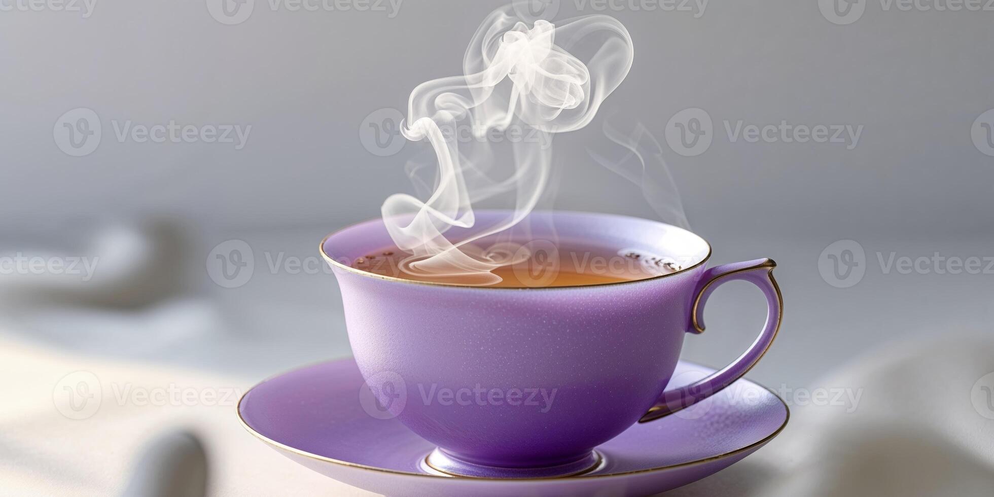 A purple teacup filled with hot tea is pictured here photo