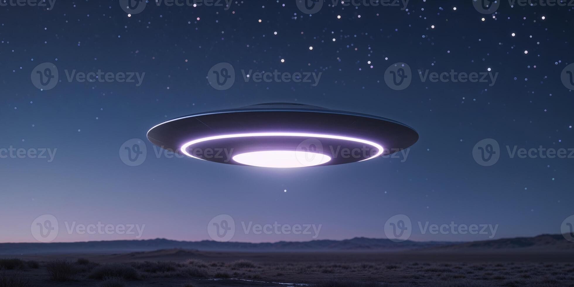 An illuminated unidentified flying object hovers above a night landscape. photo