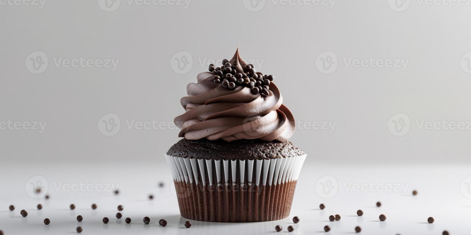 A chocolate cupcake with a swirl of frosting photo