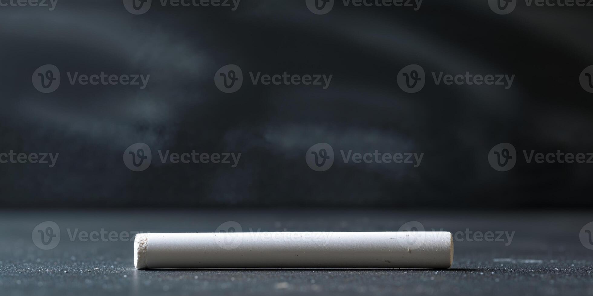 A white cigarette sitting on a table photo