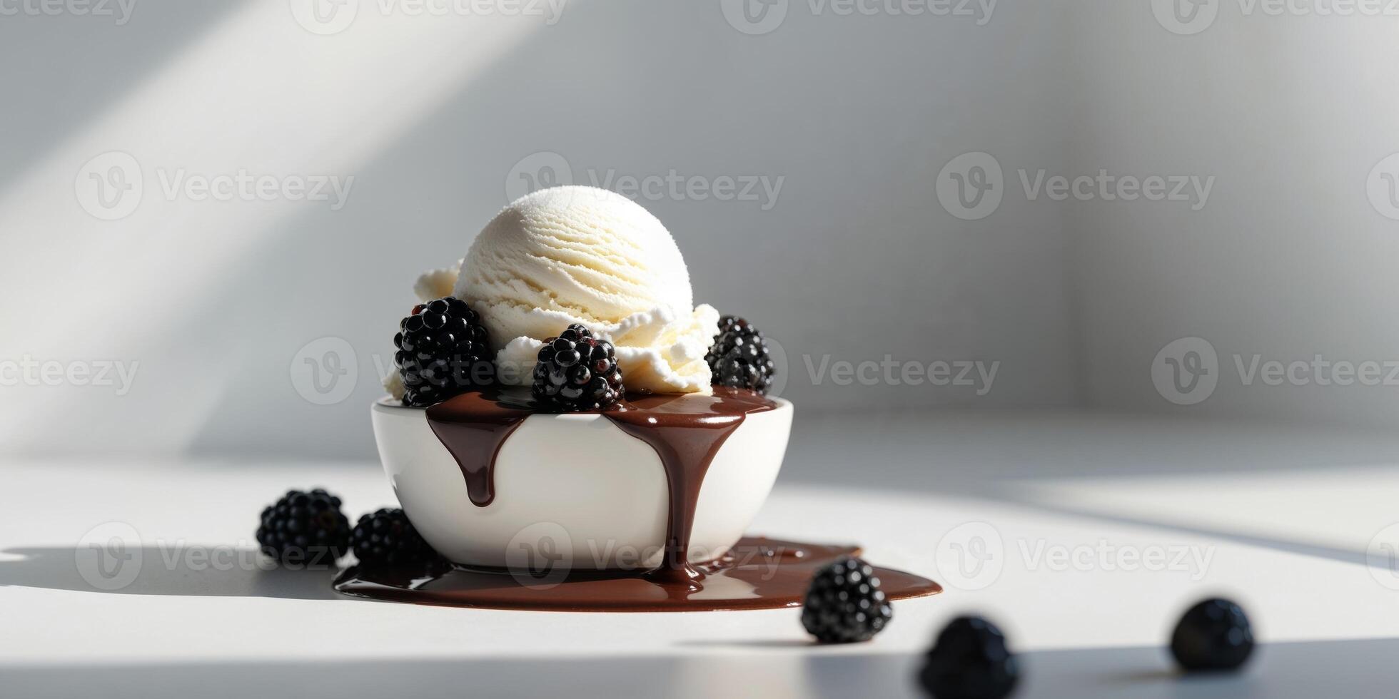 A scoop of ice cream with blackberries and chocolate photo