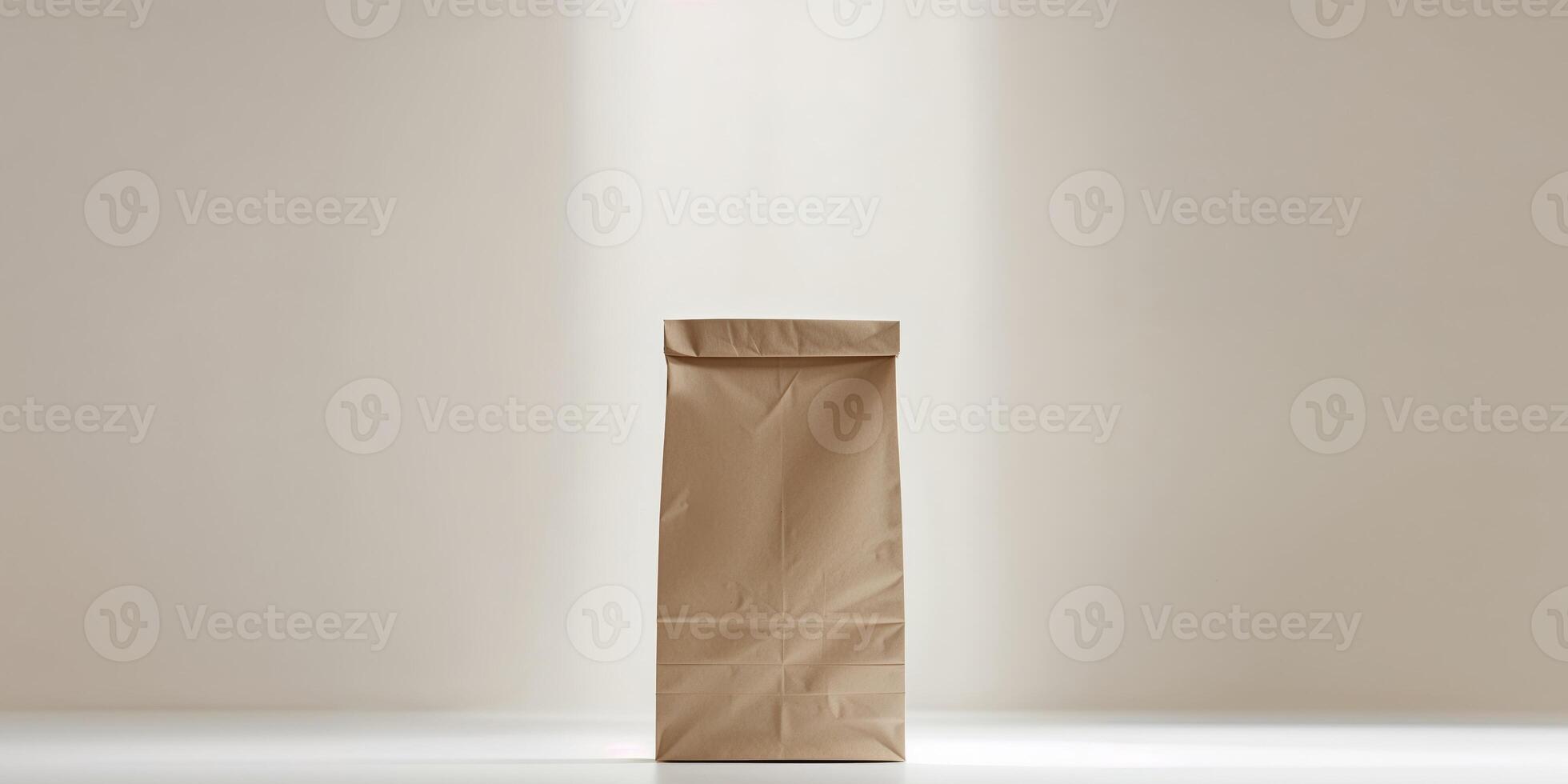 A simple brown paper bag standing upright on a white surface with soft lighting and a neutral background photo