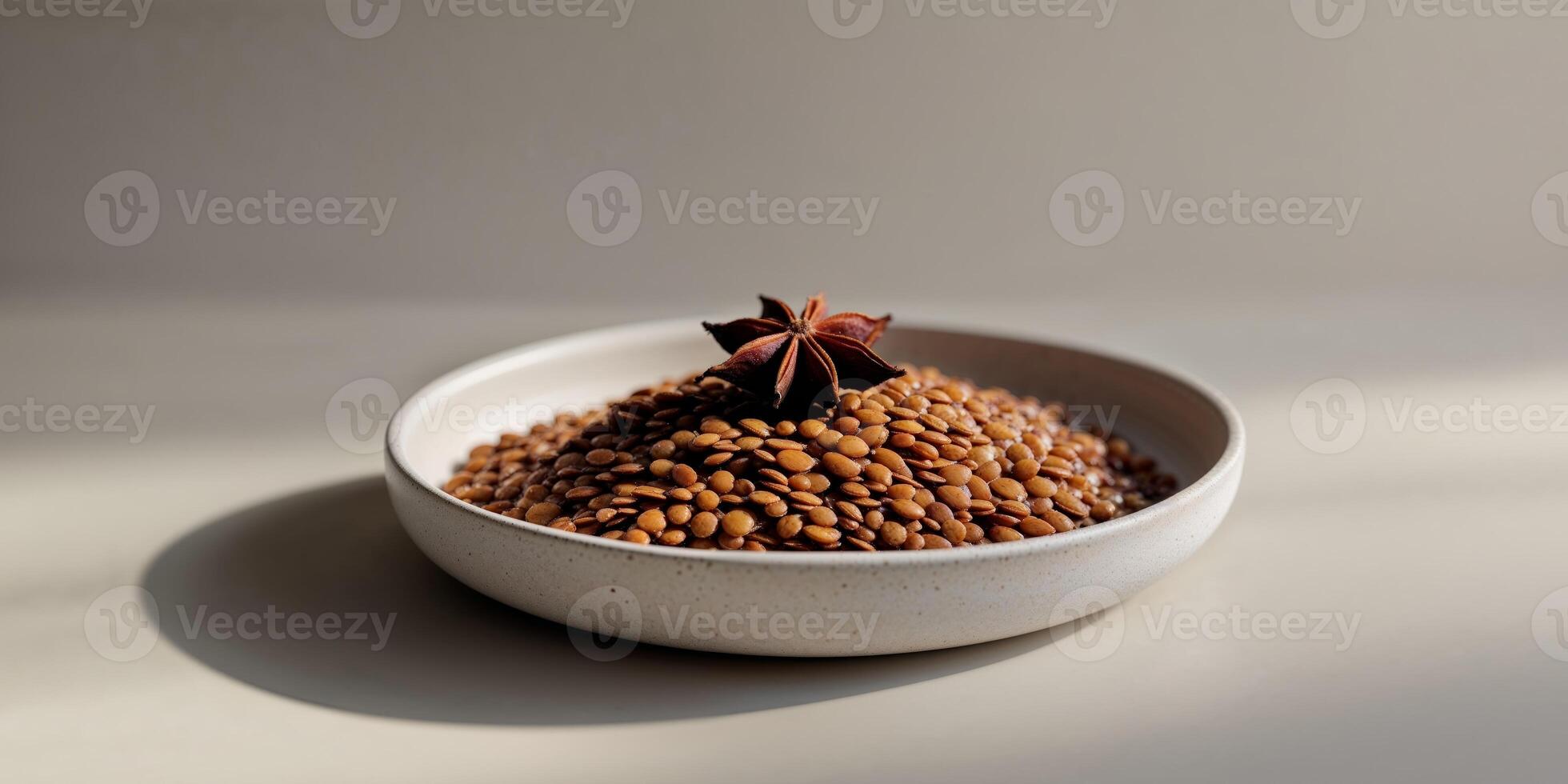 A bowl of brown seeds on a table photo