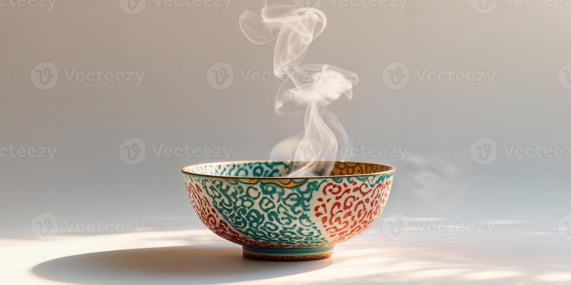 A bowl of tea with steam coming out of it photo