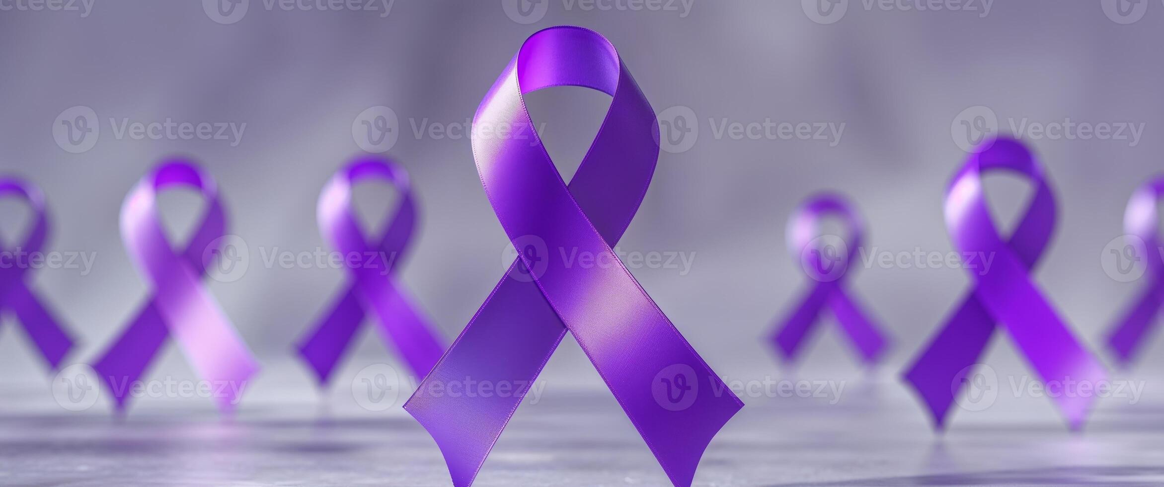 Purple awareness ribbon on a grey background photo