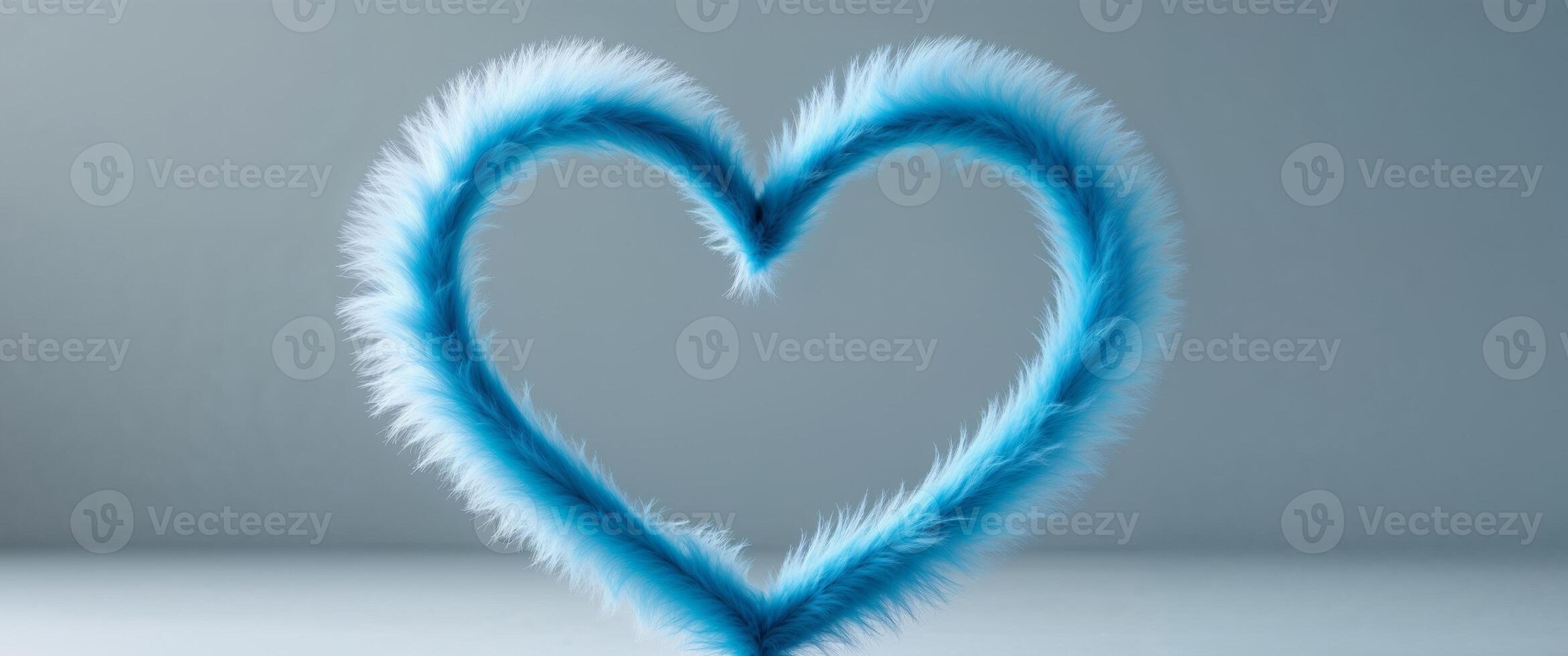 Blue feather heart on grey background photo